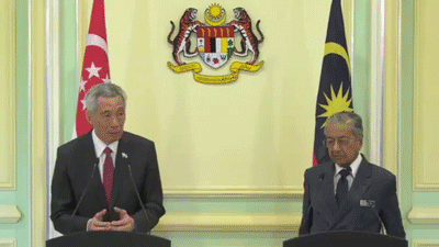Mahathir Rubs Cheeks