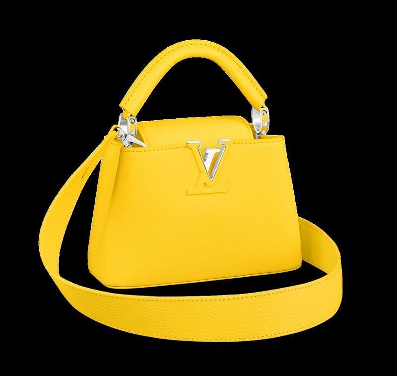 LV的亮丽黄手提包相当点睛。
