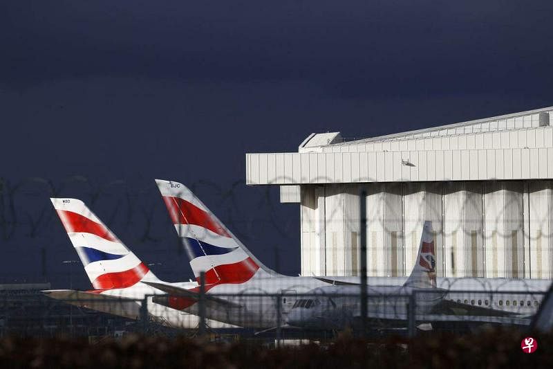 英国航空公司与工会达成加薪协议。照片为停在伦敦希思罗机场五号航站楼的英国航空公司飞机。（法新社）